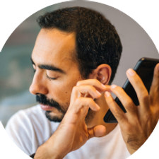 Visually impaired man using his mobile phone